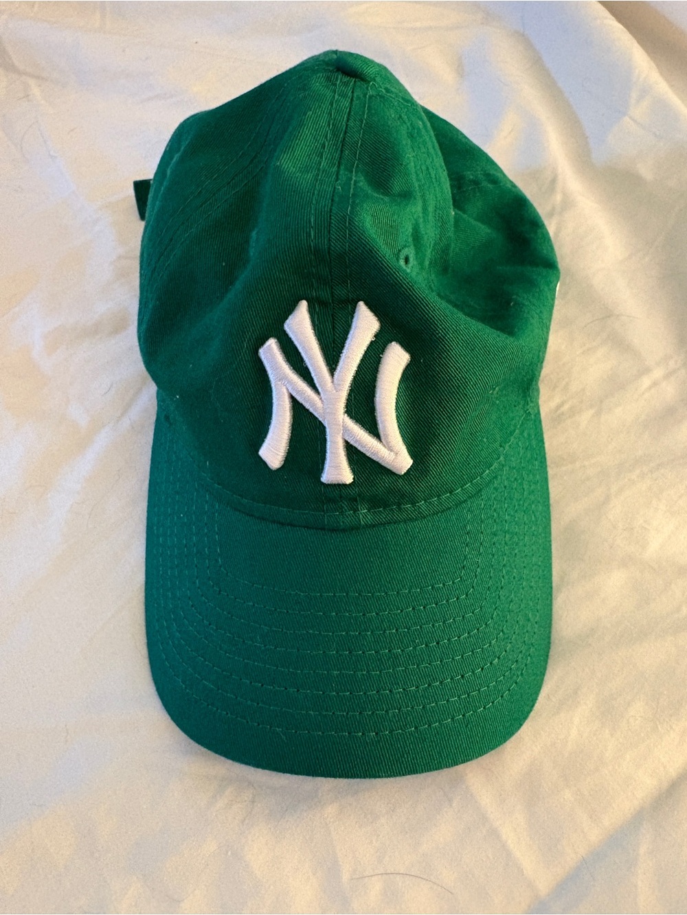 NY green hat